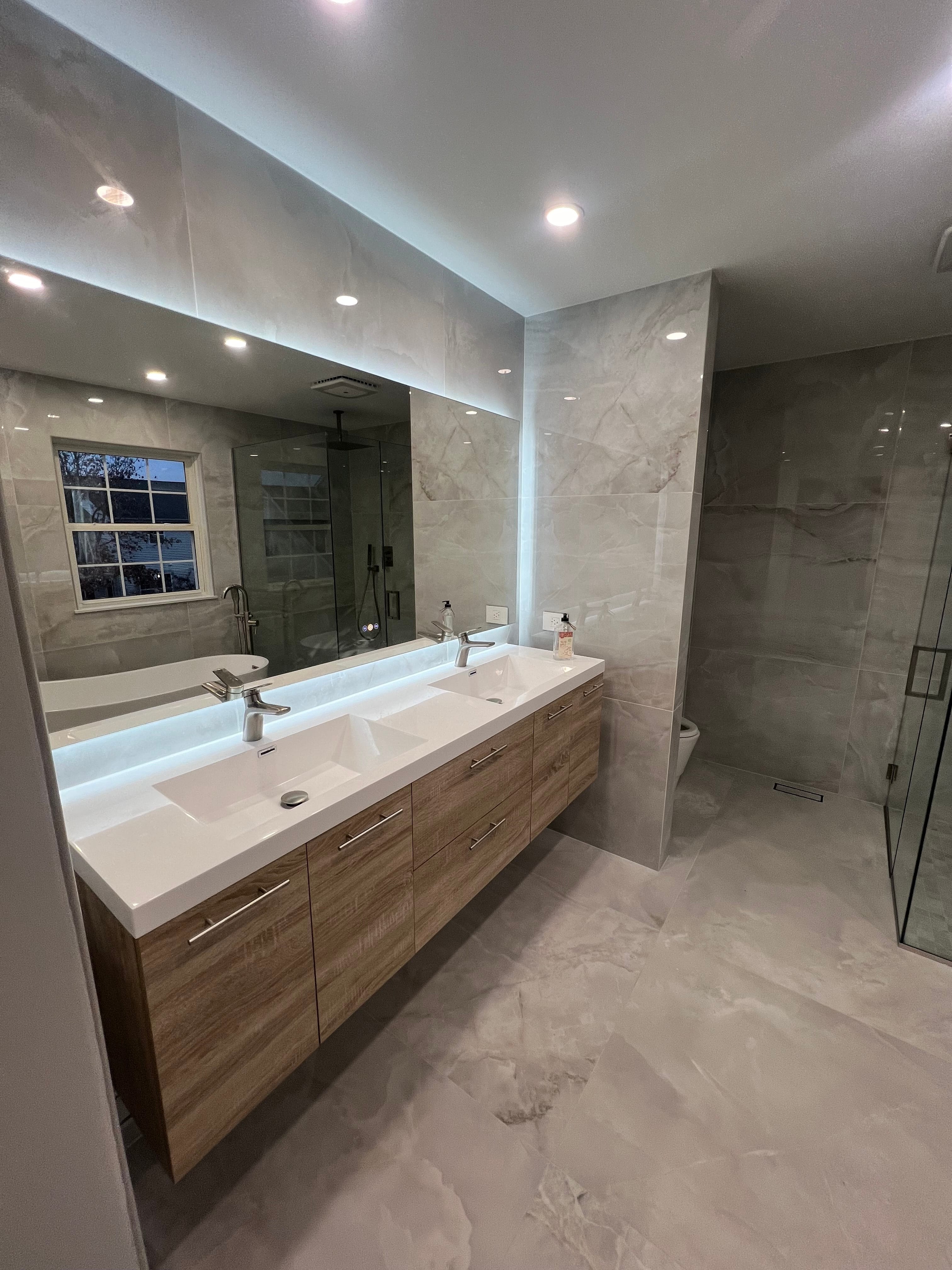 Modern LED bathroom mirror and lighting installation by professional electrician in Northwest Chicago Suburbs