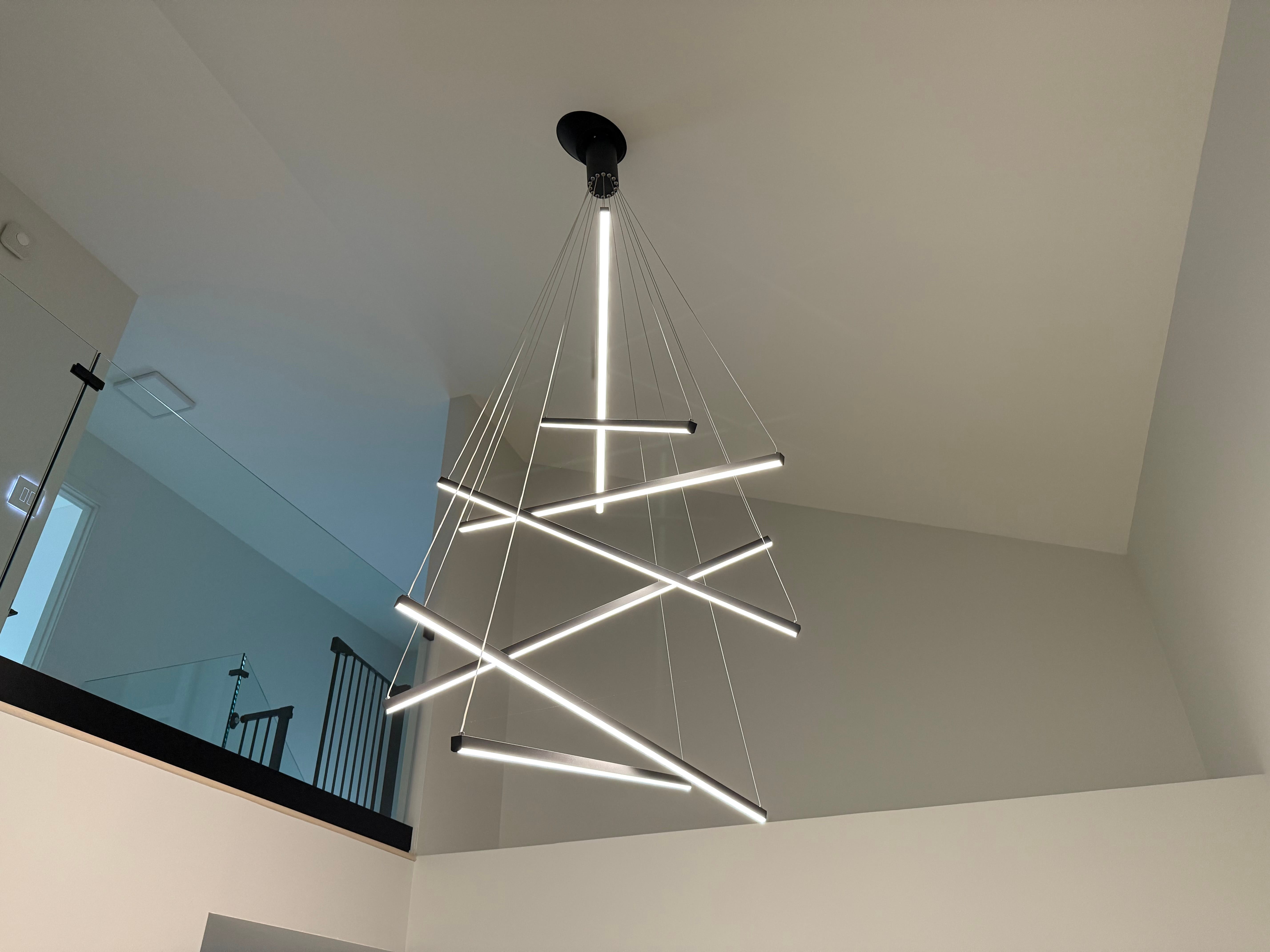 Contemporary modern chandelier installation with dimmer controls in Northwest Suburbs of Chicago home